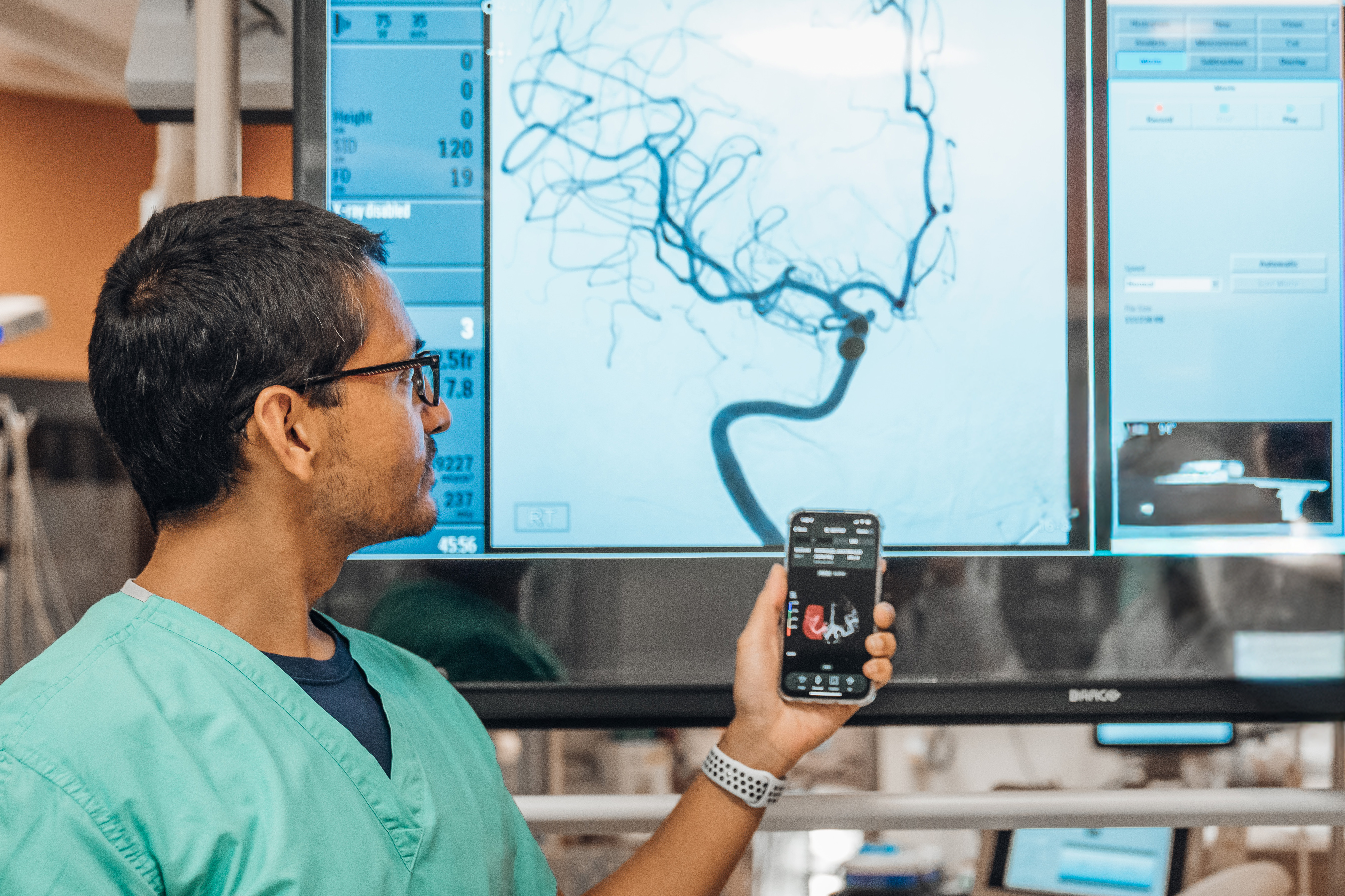 Doctor and assistant reviewing stroke image