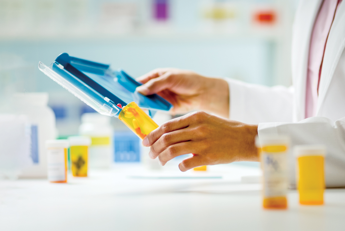 image of pharmacist filling prescriptions